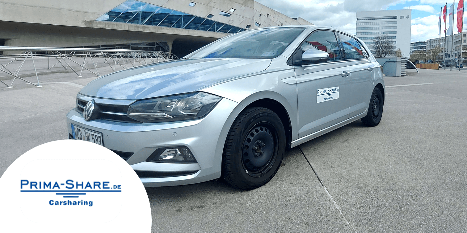 Silbernes Auto und Logo des Carsharing-Partners Prima-Share. copyright SCHRÖDER rent a car 